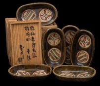 *Shoji Hamada (1894-1978) a set of six stoneware dishes: of oval press moulded form each decorated