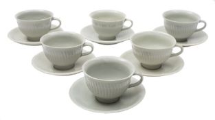 * David Leach (1911-2005) a porcelain tea service: comprising six cups with exterior fluting and