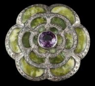 A 20th century silver plaid brooch: in the form of a stylised flower head and set with domed panels