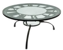 A wrought iron clock face reputedly from Euston Station adapted as a dining table:,