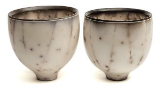 *John Nuttgens (Contemporary) a pair of porcelain vases: of heavily potted footed form under smoke
