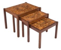A nest of three Scandinavian teak tile topped occasional tables:,