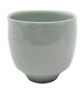 * David Leach (1911 - 2005) a porcelain bowl: of deep footed form the exterior incised with a broad