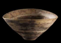 *Lucie Rie (1902-1995) a stoneware bowl: of 'squeezed' circular form decorated with banded brown,