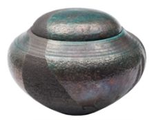 *Mansour Eskandary (Contemporary) a raku fired stoneware jar and cover: of squat form,