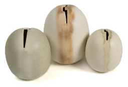 *Val Barry (1937-2018) three porcelain 'egg' vessels : each with a narrow serrated aperture,