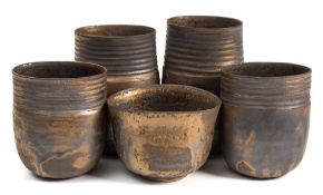 *Val Barry (1937-2018) four porcelain vases and a bowl: of thrown and 'squashed' form the former