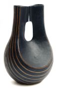 A stoneware vessel: of faceted slab built 'kettle weight' form with two triangular necks,