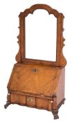 A walnut and inlaid swing frame toilet mirror in the early 18th Century taste:,