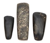 A group of three European Neolithic polished stone axe heads, circa 350 BC:.