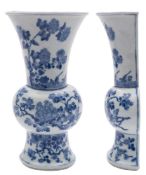 A Chinese blue and white wall vase: of rounded baluster half-section, painted with two birds, peony,