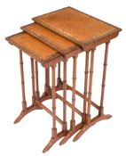 A nest of three mahogany, burr walnut and amboyna wood inlaid occasional tables:,
