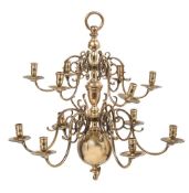 A 19th century brass twelve-branch chandelier in the Dutch style: with a knop and ball central stem