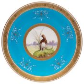 A Minton porcelain 'game bird' plate: the centre painted with a circular panel depicting a