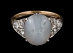 A star sapphire and diamond ring: with central oval star sapphire 12.3mm long x 10.0mm wide x 5.
