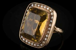 A rectangular citrine and cultured seed-pearl cluster ring: the rectangular citrine approximately