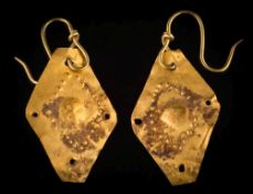 A pair of lozenge-shaped embossed gold mounted drop earrings: the drops probably of ancient