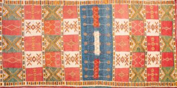 A Morrocan part flatweave rug:, with a brick red,
