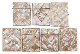 A group of seven 19th century m.o.p. card cases: each inlaid with chequer designs, 10-11 cm [7].