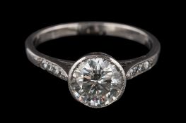 A diamond single-stone ring: the round brilliant-cut diamond approximately 7.5mm diameter x 4.