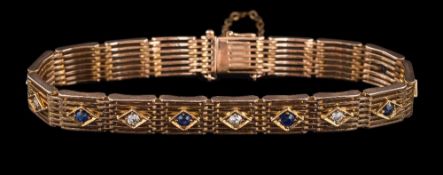An Edwardian sapphire and diamond seven-bar gate-link bracelet: each link set with either a single