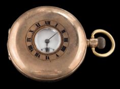 A 15ct gold half hunter pocket watch: the white enamelled dial with Roman numerals and subsidiary