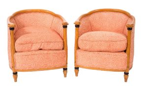 A pair of beechwood tub-shaped armchairs in the Biedermeier style:,
