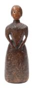 An early 18th century carved wood figure of a lady: wearing a long dress,