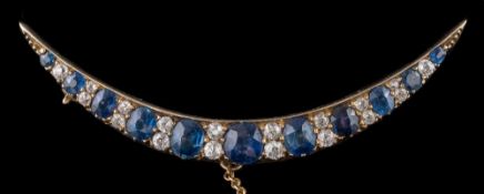 A 19th century sapphire and diamond crescent brooch: with cushion-shaped sapphires between pairs of
