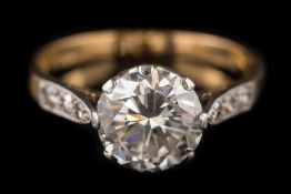 A diamond single-stone ring: the round brilliant-cut diamond approximately 8.
