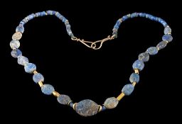 A lapis lazuli and gold bead mounted necklace: with Bactrian lapis lazuli beads and modern fittings.
