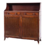A Regency mahogany chiffonier:, the shelved superstructure with a reeded edge,