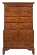 A George III oak chest on chest:, the upper part with a moulded cornice,