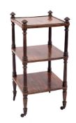 A Regency rosewood square three tier whatnot:, with reeded pointed finials and ring turned uprights,