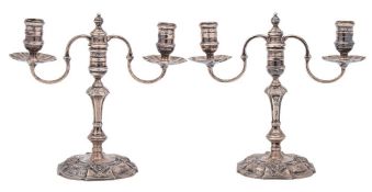 A pair of Elizabeth II silver twin branch candelabra, maker Nayler Brothers, London,