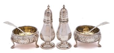 A pair of 19th century silver salts, all marks worn: crested, of circular outline,