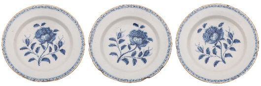 A set of three 18th century Dutch delftware blue and white dishes: each painted with a large single