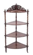 A Victorian walnut bow-fronted four tier corner whatnot:,