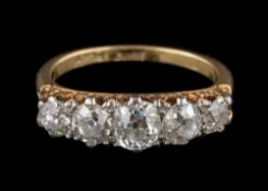 A graduated diamond five-stone ring: with cushion-shaped,