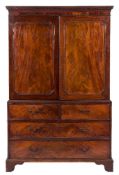 A George III mahogany linen press:, the upper part with a moulded dentil cornice,