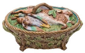 A Minton majolica game pie dish and cover: the cover moulded with dead game on a bed of ferns,