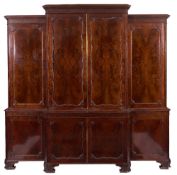 A carved mahogany breakfront library cabinet bookcase in the Chippendale taste:,