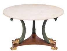 A carved and decorated wood circular centre table in the Regency taste:,