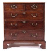 A George III mahogany rectangular chest:, the top with a moulded edge,