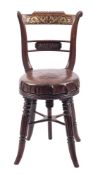 A Regency rosewood, simulated and brass inlaid harpists revolving chair:,