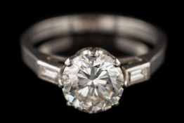 A diamond single-stone ring: the round brilliant-cut diamond approximately 7.3mm diameter x 4.
