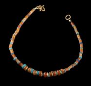 A spiral disc, cornelian and faience bead bracelet:.