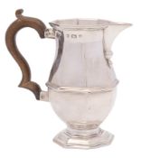 A George V silver cream jug, maker's mark worn, Birmingham, 1911: of octagonal baluster form,