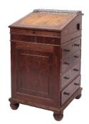 A Regency mahogany davenport:, the sliding superstructure with beaded mouldings,