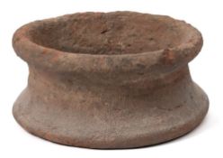 An Egyptian pottery jar support: of circular form 18cm diameter.